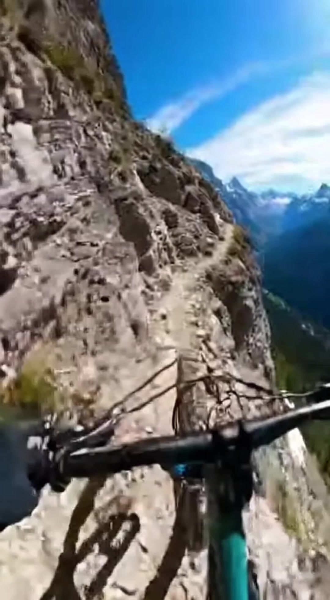 A Rider Navigates an Extremely Narrow Mountain Trail.